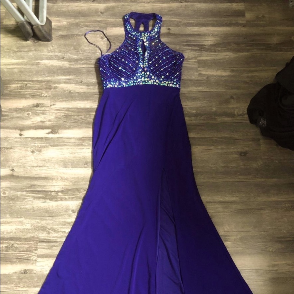Purple prom dress with a keyhole-halter neckline and an open back
